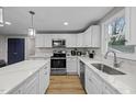 Bright kitchen featuring stainless steel appliances, ample counter space, and sleek finishes at 2908 Woods Pl, Raleigh, NC 27607