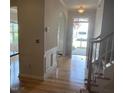 Inviting foyer with beautiful wood floors, elegant trim work, and an arched entryway to adjacent room at 3108 Fortress Gate Dr, Raleigh, NC 27614