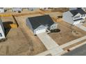 An aerial view of a single-Gathering home displaying the roof, driveway, and surrounding neighborhood at 45 Florentine Ct, Angier, NC 27501