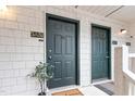 Close-up of condo front door with welcome mat and green paint at 600 Audubon Lake Dr # 5A32, Durham, NC 27713