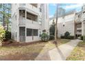 A condo building with a walkway, screened porch and well maintained landscaping at 600 Audubon Lake Dr # 5A32, Durham, NC 27713