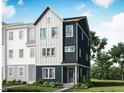 Modern townhome showcasing a two-story design with a mix of dark blue and white siding, complemented by lush green landscaping at 810 Hyperion Aly, Wake Forest, NC 27587