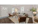 Cozy living room with hardwood floors, natural light, and stylish furniture at 1012 Holloway St, Durham, NC 27701