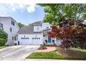 Beautiful two-story home with a well-manicured lawn, a front porch, and a two car garage at 109 Parkridge Ave, Chapel Hill, NC 27517