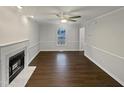 Bright living room with fireplace, ceiling fan and hardwood floors at 1599 Rogers Pointe Ln, Creedmoor, NC 27522