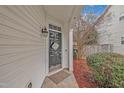 Inviting front door with stylish decor and a charming welcome sign at 181 Steam Engine Way, Garner, NC 27529