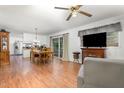 Open floor plan showcasing the living room with fireplace and dining area adjacent to the kitchen at 2005 Sutphin Dr, Sanford, NC 27330