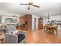 Spacious living area with a brick fireplace feature and an open view to the dining area and kitchen at 2005 Sutphin Dr, Sanford, NC 27330