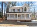 Beautiful two-story home with a cozy front porch, perfect for relaxing and enjoying the neighborhood at 209 Hutchins Dr, Garner, NC 27529