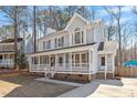 Attractive two-story house boasting a lovely porch, providing ample space for outdoor seating at 209 Hutchins Dr, Garner, NC 27529