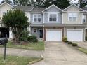 Charming townhome featuring a one car garage, complemented by tasteful landscaping and curb appeal at 2114 Stoney Spring Dr, Raleigh, NC 27610