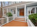 Charming front porch with stately columns and detailed trim, inviting guests into the home at 216 Copper Beech Ct, Chapel Hill, NC 27517