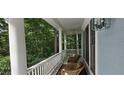 Relaxing screened porch with comfortable seating and a ceiling fan, perfect for enjoying the outdoors at 216 Copper Beech Ct, Chapel Hill, NC 27517