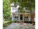 Charming two-story home with a welcoming front porch, neutral siding, and a well-maintained lawn at 4713 Malone Ct, Raleigh, NC 27616