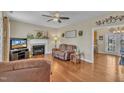 Bright living room with a fireplace, hardwood floors, and ample natural light at 505 Wild Goose Ln, Creedmoor, NC 27522