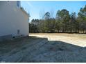 Large grassy backyard with an open field perfect for activities at 5705 Flowery Meadow Ct, Wake Forest, NC 27587