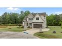 Stylish two-story home with a two-car garage and a well-kept lawn at 5705 Flowery Meadow Ct, Wake Forest, NC 27587