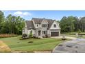 Charming two-story home featuring a modern exterior with well-maintained landscaping at 5705 Flowery Meadow Ct, Wake Forest, NC 27587