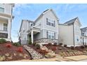 Attractive home showcasing a meticulously landscaped yard with natural stone accents at 6509 Archwood Ave, Raleigh, NC 27616