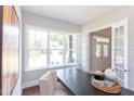 Bright office space featuring a large desk, natural light, and modern decor at 9517 Wood River Dr, Zebulon, NC 27597