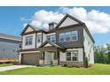 Lovely home with a two-car garage, covered entry, and lush green lawn at 1404 Malcus Ct # 56, Fuquay Varina, NC 27526