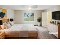 Bright bedroom with a large window, ceiling fan, and an en-suite bathroom at 1419 Mangum Ave, Creedmoor, NC 27522