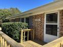 Close up of the front porch and front door of the brick home at 1516 Park Ln, Hillsborough, NC 27278