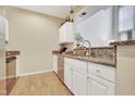Well-maintained kitchen featuring granite countertops and stainless steel appliances at 200 S Dawson St # 103, Raleigh, NC 27601