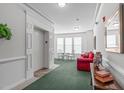 Comfortable lobby with an elevator, seating, and a view of the outdoors, enhancing the common space at 232 Eyam Hall Ln, Apex, NC 27502