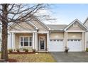 Attractive one-story home with a two-car garage and a cozy front porch at 2815 Mebane Ln, Durham, NC 27703