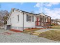 Charming single-story home featuring a welcoming porch and well-maintained lawn at 318 Fulton St, Burlington, NC 27217