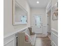 Bright entryway with hardwood floors, bench seating and an elegant front door at 464 Granite Saddle Dr, Rolesville, NC 27571