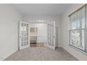 Home office with French doors and natural light at 464 Granite Saddle Dr, Rolesville, NC 27571