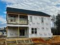 New two-story house under construction with a back deck and balcony at 49 Golden View Pl, Zebulon, NC 27597