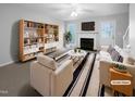 Bright and airy living room features a fireplace and ample natural light at 516 Caprice Ct, Raleigh, NC 27606