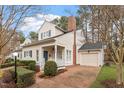 Attractive two-story house with a covered front porch and attached one-car garage at 800 Mill Greens Ct, Raleigh, NC 27609