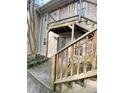 Exterior unit entrance featuring covered staircase and concrete walkway at 1513 E Franklin St # C129, Chapel Hill, NC 27514