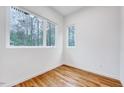 Bright bedroom with natural light and hardwood floors offers a calming and minimalist space at 1604 Malta Ave, Raleigh, NC 27610