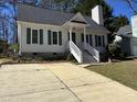 Charming one-story home with a well-manicured lawn, inviting front porch, and a long driveway at 1811 Kelly Glen Dr, Apex, NC 27502