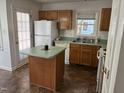 Functional kitchen with a center island, ample counter space, and matching appliances at 1811 Kelly Glen Dr, Apex, NC 27502