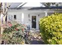 Inviting front porch with steps leading to the front door and lush greenery at 2606 W Knox St, Durham, NC 27705