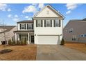 Two-story white home with black shutters, attached two-car garage, and a manicured front lawn at 456 Highview Dr, Benson, NC 27504