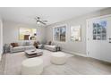 Bright living room featuring a large sectional sofa and stylish decor at 4610 Lemon Heights Dr, Sanford, NC 27332