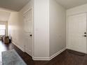 Welcoming foyer with hardwood floors and neutral paint at 521 Renshaw Ct, Cary, NC 27518