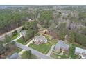 Brick home situated on large lot with mature trees and lush green lawn at 6 Kersey Ct, Durham, NC 27713