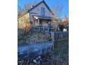 View of the home showing the yard and covered porch at 206 S Goley St, Durham, NC 27701