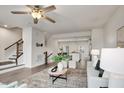 Open-concept living area leading to the kitchen and dining space with modern decor and natural light at 240 Amber Acorn Ave, Raleigh, NC 27603