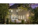 Elegant brick home with a spacious terrace, multiple windows, and manicured greenery at 2658 Davis St, Raleigh, NC 27608