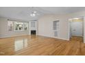 Bright living room with hardwood floors, fireplace, large windows and vaulted ceilings at 276 Sagamore Dr, Louisburg, NC 27549