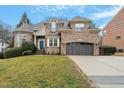 Attractive brick home with a two-car garage, well-maintained lawn, and a welcoming entrance at 3025 Osterley St, Raleigh, NC 27614